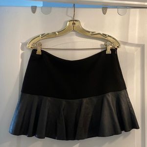 Black mini skirt with leather ruffle